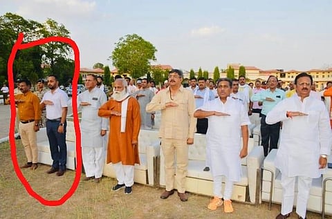Satna district collector Anurag Verma and Satna municipal commissioner Rajesh Shahi do the RSS salute at a program in Satna district