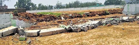 The collapsed portion of the hockey centre’s boundary wall at Bhalulata | Express