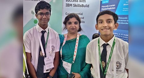 Young innovators Shayaan Ahmad (right) and Swaminathan Vivekanand (left) with their DPS Bangalore North principal Manju Balasubramanyam at the CBSE stall in G20 exhibition. (Photo | EPS)
