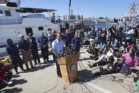 US Coast Guard Rear Adm. John Mauger, commander of the First Coast Guard District, center at microphone, talks to the media on June 22, 2023, at Coast Guard Base Boston, in Boston | AP
