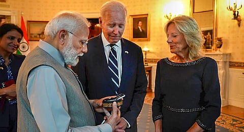 PM Narendra Modi gifts a 7.5-carat lab-grown diamond placed in a papier mache box from Kashmir, known as 'kar-e-kalamdani' to US First Lady Jill Biden. (Photo | PTI)