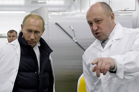 Yevgeny Prigozhin (right) and Russian President Vladimir Putin during happier times (File Photo | AFP)