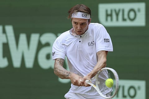 Kazakhstan's Alexander Bublik returns the ball to Russia's Andrey Rublev during their final match at the German Tennis Open, in Halle, Sunday, June 25, 2023. (photo |AP)