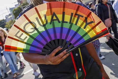 A person holds a fan that reads 'Equality' during the 31st annual San Francisco Dyke March. (Photo | AP)