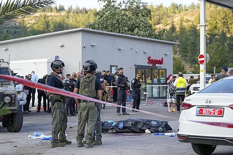 Representational Image: Israeli police stand next to the body of a Palestinian gunman at the scene of a shooting attack near the West Bank Israeli settlement of Eli, June 20, 2023. (Photo | AP)