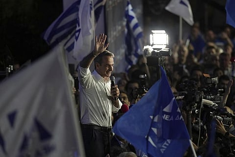 Kyriakos Mitsotakis leader of the center-right New Democracy addresses to supporters outside the headquarters of the party in Athens after his landslide victory. (Photo | AP)
