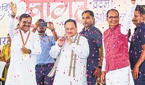 Madhya Pradesh CM Shivraj Singh Chouhan and BJP state President VD Sharma welcome BJP national president JP Nadda in Bhopal. (Photo | PTI)