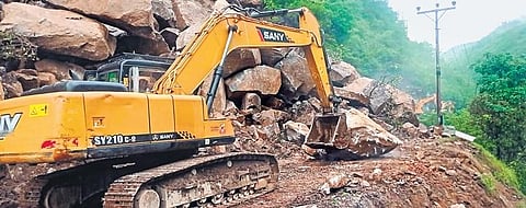 Debris being cleared from the Chandigarh-Manali highway following landslides triggered by continuous rain in Mandi. (Photo | PTI)