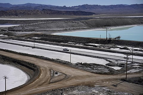 FILE - A truck drives past brine evaporation ponds at Albemarle Corp.'s Silver Peak lithium facility, on Oct. 6, 2022, in Silver Peak, Nevada, USA. (Photo | AP)