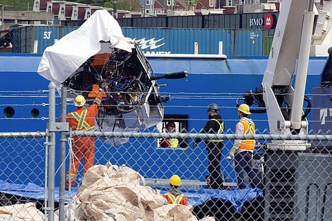 Debris from the Titan submersible, recovered from the ocean floor near the wreck of the Titanic, is unloaded from the ship Horizon Arctic at the Canadian Coast Guard pier. (Photo | AP)