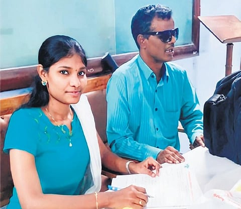 Gomathi K helping a visually impaired man to write an exam | Express