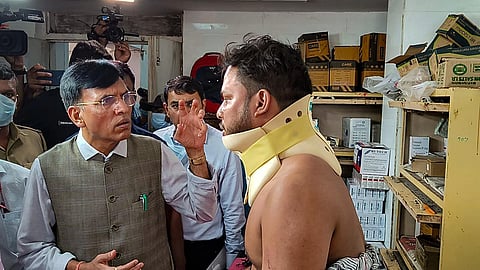 Union Health Minister Mansukh Mandaviya meets an injured at Capital Hospital following the crash (Photo | PTI)