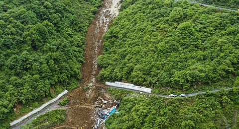 This aerial photo released by the Xinhua News Agency shows the site of a mountain collapse in Leshan in southwestern China's Sichuan Province. (Photo | AP)