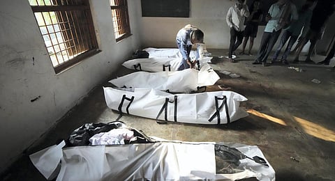 Relatives of victims during body identification at a temporary mortuary at Bahanaga High School.(Photo | PTI)