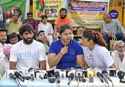 FILE - Wrestlers Sakshi Malik, Vinesh Phogat and Bajrang Punia rejoined their posts as OSD (Sports) in the Indian Railways, on Monday. (Photo | ANI)