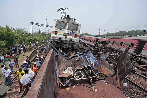 Rescuers work at the site of passenger trains that derailed in Balasore district, in Orissa, Saturday, June 3, 2023. (Photo | AP)