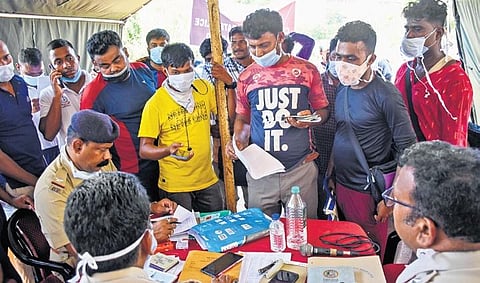 Families and relatives of victims waiting for paperwork before taking possession of bodies at AIIMS, Bhubaneswar on Monday I Express
