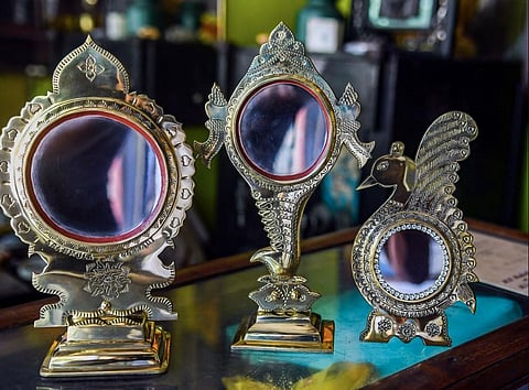Kerala's famous Aranmula mirrors are on display at a shop, in Thiruvananthapuram, Tuesday, June 6, 2023. (PTI)