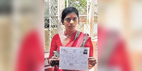 Meera Devi showing her son’s details