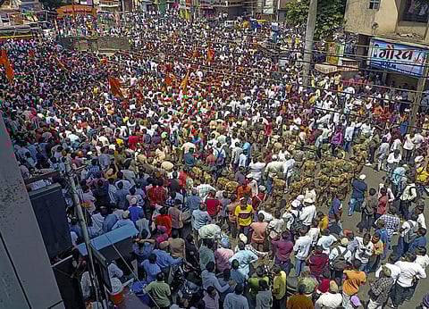 People gather to protest against the alleged use of Tipu Sultan's image in objectionable social media posts. (Photo | PTI)