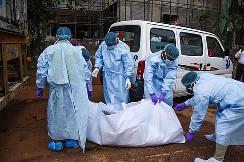 A body being taken out of deep freeze container before handling over to the next kins at AIIMS, Bhubaneswar. (Photo | Debadatta Mallick, EPS)
