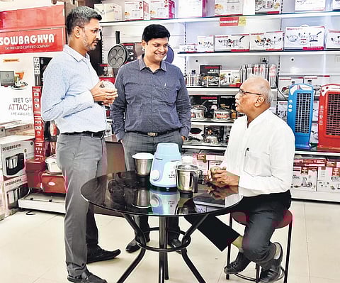 Varadharajan with his sons at Sowbaghya’s T Nagar office | P Jawahar