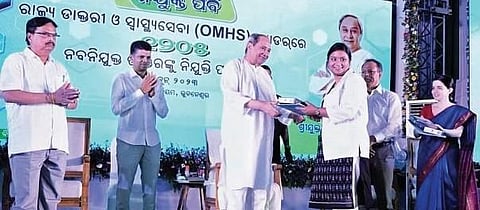 Chief Minister Naveen Patnaik handing over appointment letter to a doctor | Express