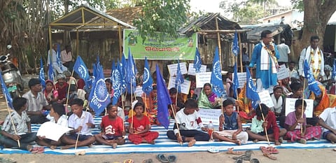 Several tribals including children led by the president of Dalit Bikash Parishad Sankar Das sat on dharna (Photo | Twitter)