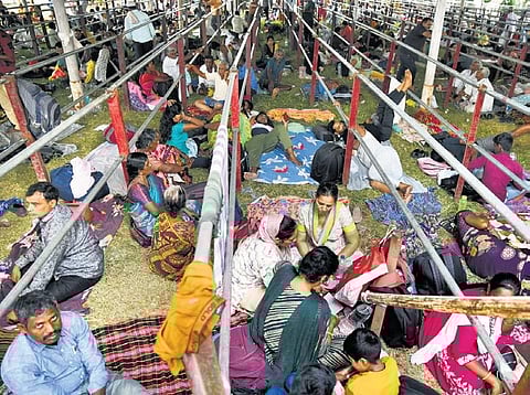 People in large numbers wait at Exhibition Grounds in Nampally, Hyderabad, to receive fish prasadam, on Thursday | Vinay Madapu