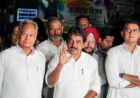 FILE - Rajasthan Chief Minister Ashok Gehlot and his former Deputy Sachin Pilot with Cong Gen Secy K C Venugopal after a meeting in Delhi. (Photo | PTI)