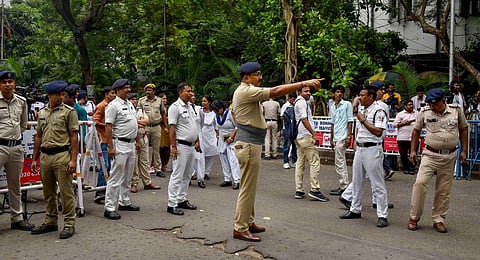 Security personnel stand guard in front of Enforcement Directorate office during the appearance of Senior TMC leader Abhishek Banerjee's wife Rujira for questioning.(Photo | PTI)