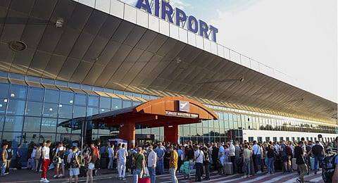 Travelers crowd the entrance to the Chisinau airport in Moldova s it reopened after a lock down because of the shooting. (Photo | AP)