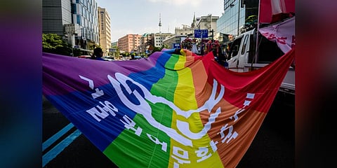 Seoul's Namsan Tower (back top C) is seen as people attend a Pride event in support of LGBTQ rights, during the Seoul Queer Culture Festival, in Seoul. (Photo | AFP)