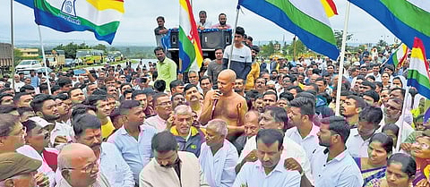 Members of the Jain community stage a protest on NH4 in Belagavi on Sunday