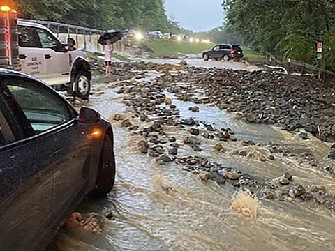 Vehicles come to a standstill near a washed-out and flooded portion of the Palisades Parkway just beyond the traffic circle off the Bear Mountain Bridge, July 9, 2023, in N.Y. (Photo |AP)