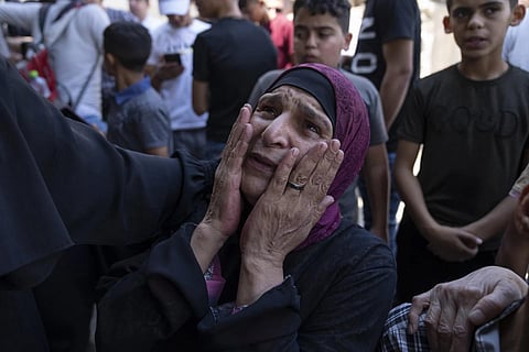 Khayriah, mother of Hamza Maqbool, cries during his funeral in the West Bank city of Nablus, July 7, 2023. (Photo | AP)