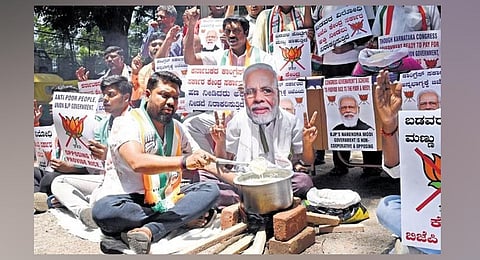 FILE - Youth Congress members protest against the Centre for discontinuing the sale of rice and wheat from its pool, in Bengaluru, June 16, 2023. (Photo | Vinod Kumar T, EPS)