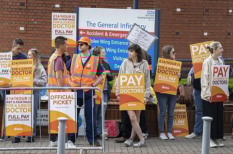 Junior doctor and members of the British Medical Association (BMA) stand on the picket line outside Leeds General Infirmary at the start a five-day strike. (Photo | AP)