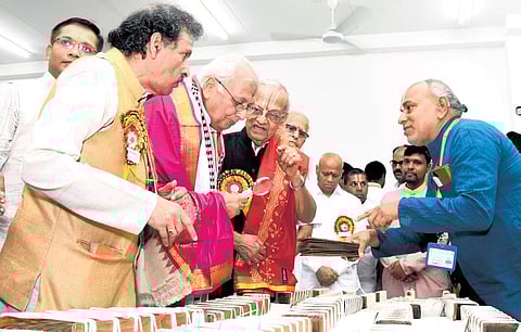 Governor of Kerala Arif Mohammed Khan looking at the ancient manuscripts in the exhibition during the National Sanskrit Convention held at NSU (Photo | Madhav K)