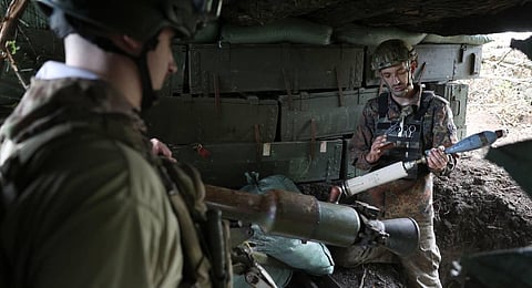 Ukrainian servicemen from the K-2 battalion prepare a 73-mm SPG-9 recoilless gun at a frontline position near the town of Siversk, Donetsk region. (Photo | AFP)