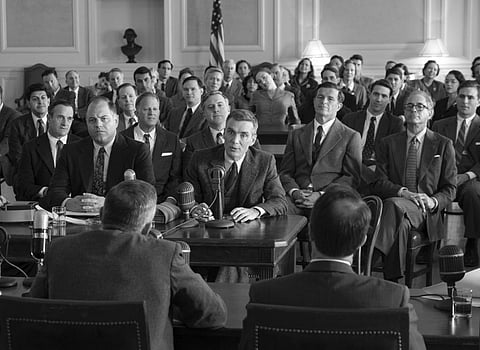 This image released by Universal Pictures shows Cillian Murphy, center, in a scene from 'Oppenheimer.' (AP)