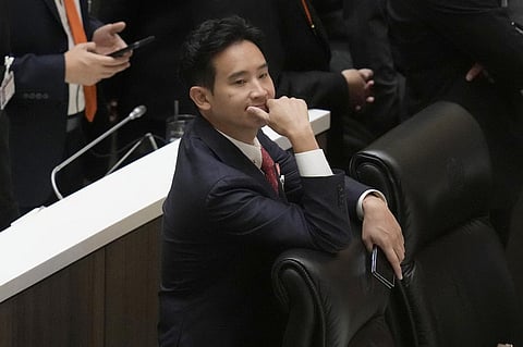 Pita Limjaroenrat, the leader of Move Forward Party and top winner in the May's general election reacts during vote counting at the Parliament. (Photo | AP)