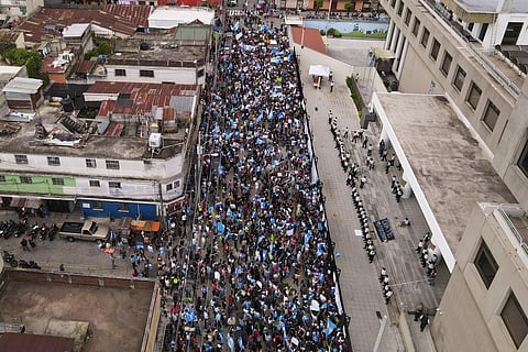 Supporters of the Seed Movement party protest outside Guatemala's Attorney General's office building in Guatemala City, Thursday, July 13, 2023. (Photo | AP)