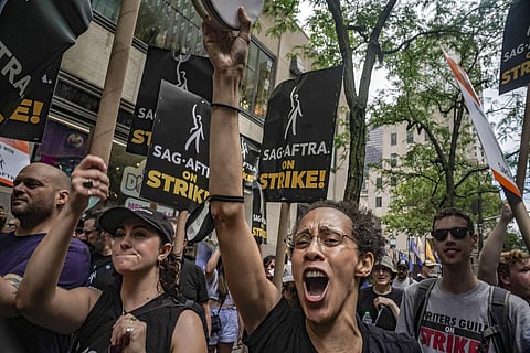 Striking writers and actors take part in a rally outside Paramount studios in Los Angeles. (Photo | AP)