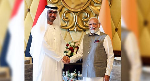 Prime Minister Narendra Modi and president-designate of the 28th session of the UN Climate Change (COP28 in UAE) Sultan Al Jaber during a meeting, in Abu Dhabi. (Photo | PTI)