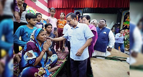 Delhi Chief Minister Arvind Kejriwal interacts with people at a flood relief camp following monsoon rains, at Mori Gate in New Delhi. (Photo | PTI)