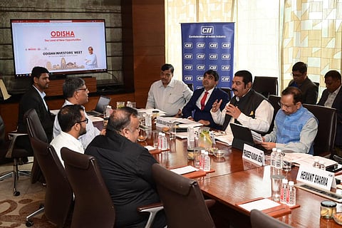 The Odisha government delegation interacting with industry leaders at Raipur.