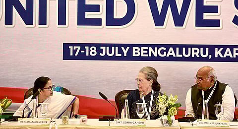 Congress President Mallikarjun Kharge with party leader Sonia Gandhi and West Bengal CM Mamata Banerjee during the Opposition leaders' dinner in Bengaluru, Monday, July 17, 2023. (Photo | ANI)