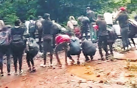 A video grab showing tourists doing sit-ups