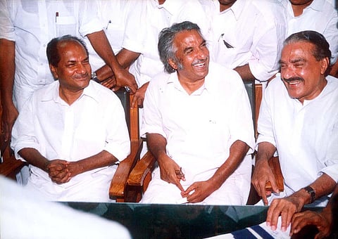 Oommen Chandy having a light moment with A K Antony and K M Mani. (File | EPS)